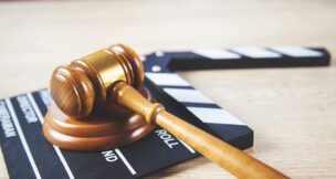 Gavel and film clapperboard