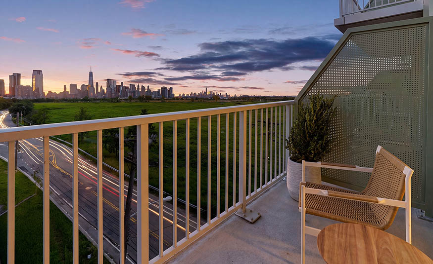A balcony view of the Manhattan skyline at sunset from aviva on the edge of Liberty State Park in Jersey City. PROVIDED BY AVIVA