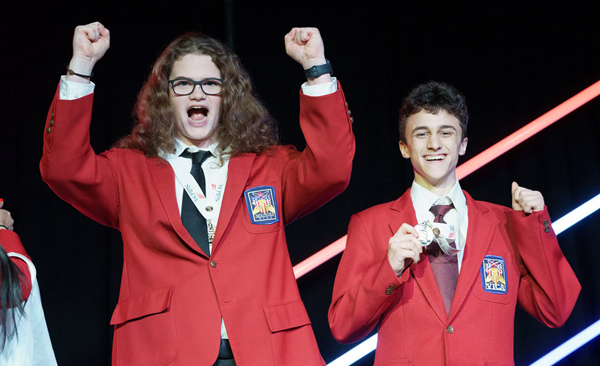 Peter Stout (left) and Scott Turner (right_, recent graduates of the Mercer County Technical Schools STEM Academy, celebrate winning a gold medal at the national SkillsUSA event in the Interactive Application and Video Game Development category.